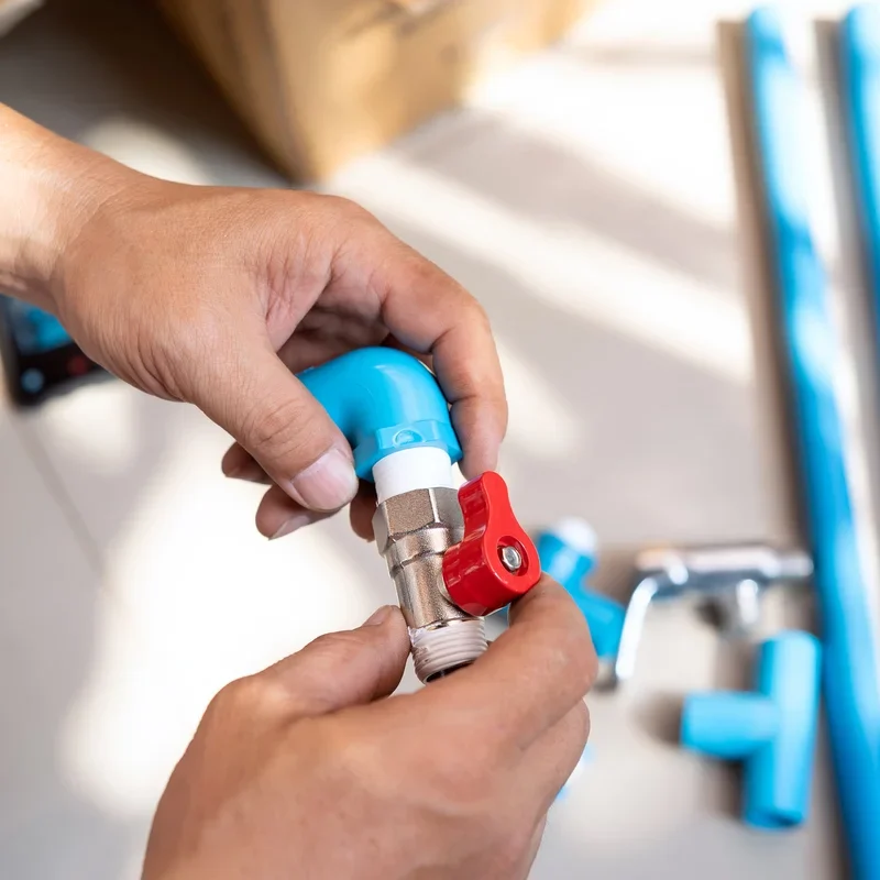 vecteezy_plumber-putting-teflon-thread-tape-on-the-thread-preparing_7135641